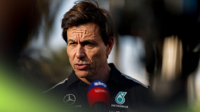 Toto Wolff in Mercedes team wear speaks in a television interview.