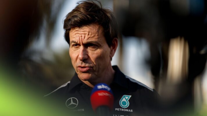 Toto Wolff in Mercedes team wear speaks in a television interview.
