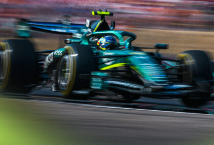 Fernando Alonso in action on track driving an Aston Martin AMR26.