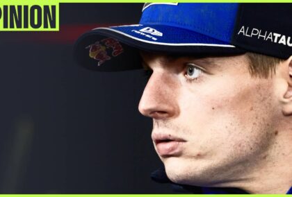 Max Verstappen looks to his right in a press conference with an 'opinion' tab in the top-left corner