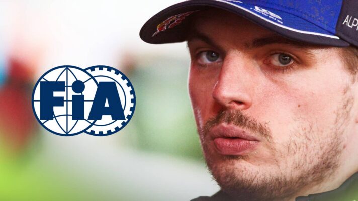 A close-up shot of Max Verstappen eyeing the camera with a prominent FIA logo alongside him