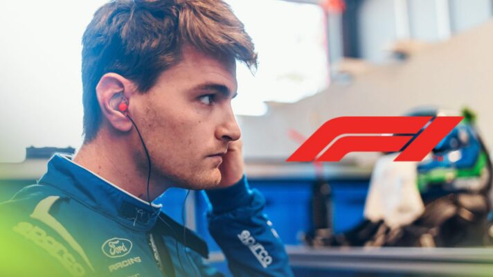 Logan Sargeant pictured at the 2026 Imola WEC round, as an F1 logo appears on the right