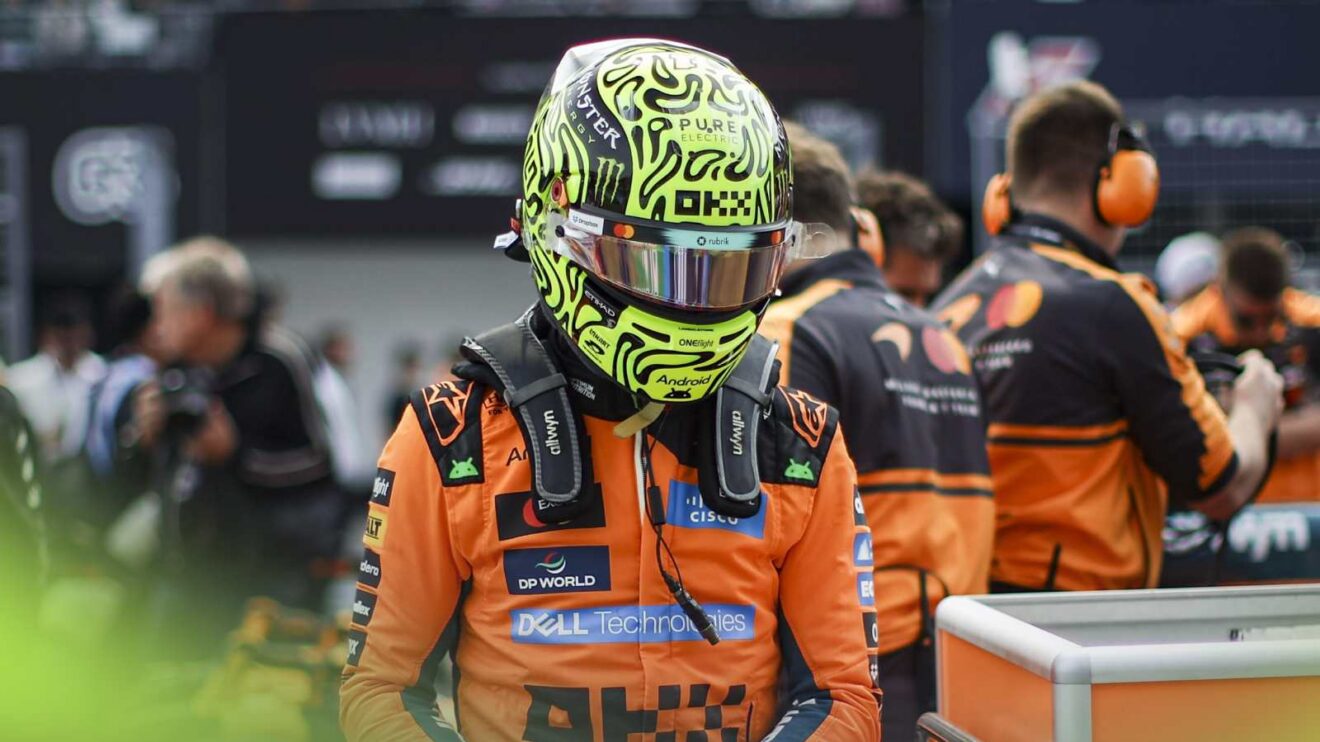 Lando Norris wears his helmet on the grid at Suzuka.