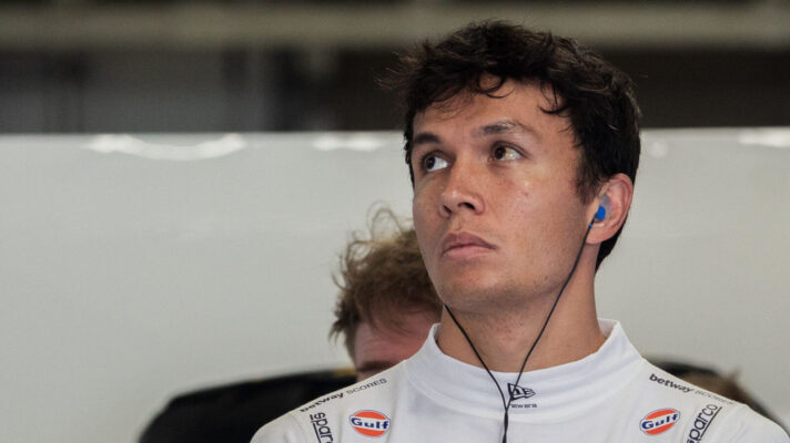Alex Albon looking off to the side