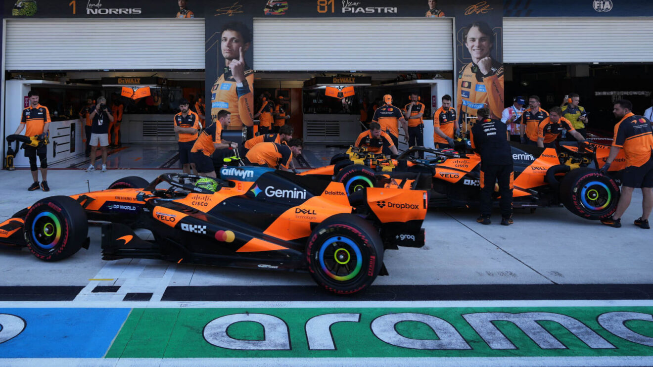Lando Norris and Oscar Piastri in the pit lane