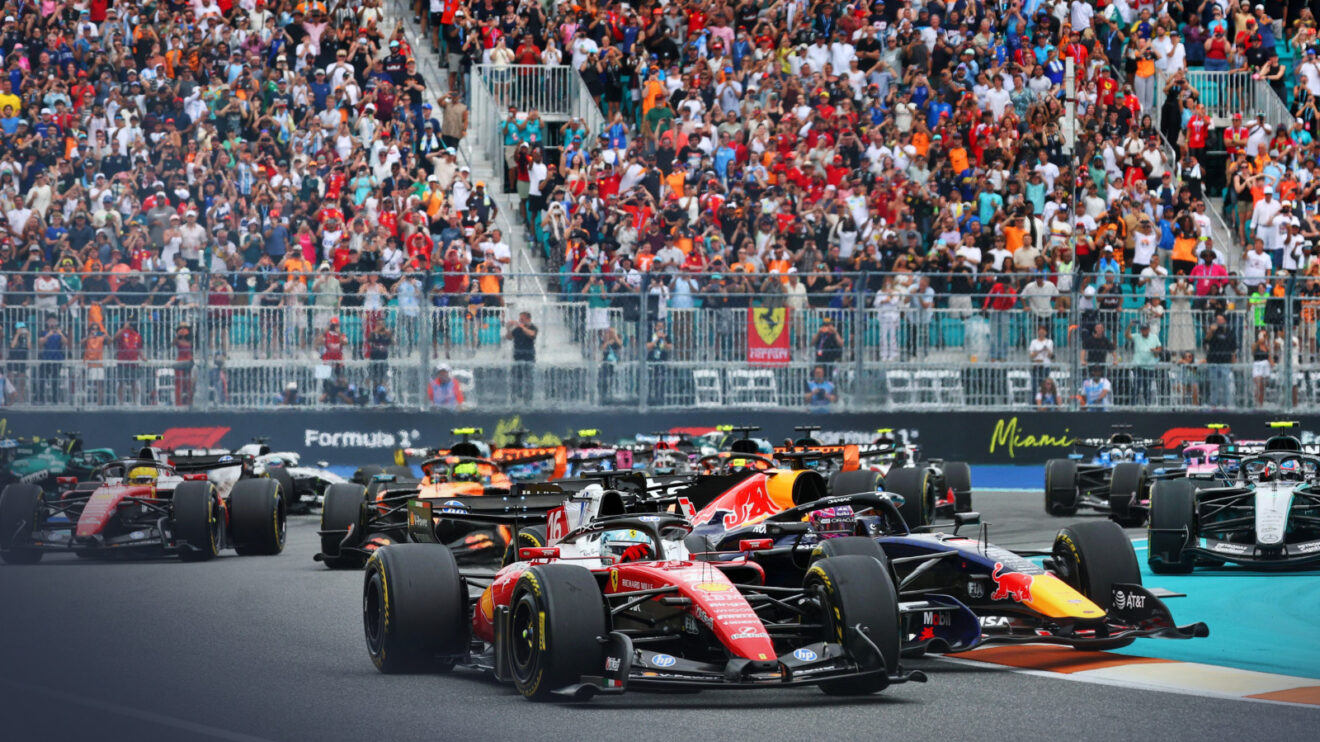 Charles Leclerc leads the pack out of Turn 1 in Miami as Max Verstappen in second begins to spin in front of the pack.