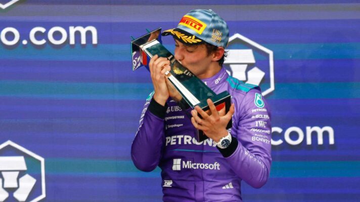 Kimi Antonelli kisses the winner's trophy in Miami.