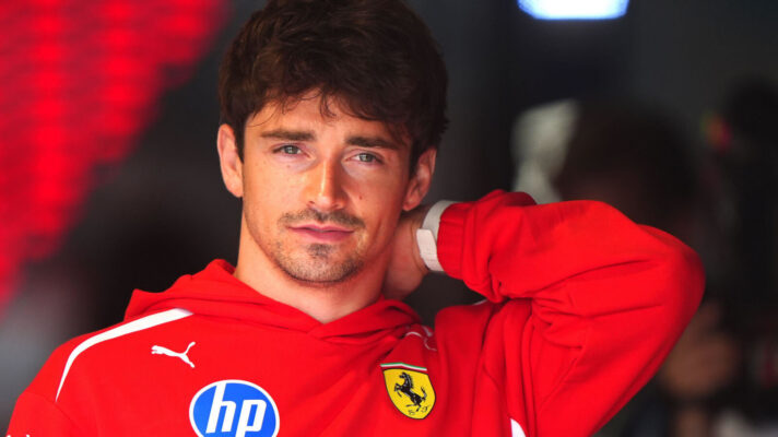 Charles Leclerc with his hand on the back of his neck