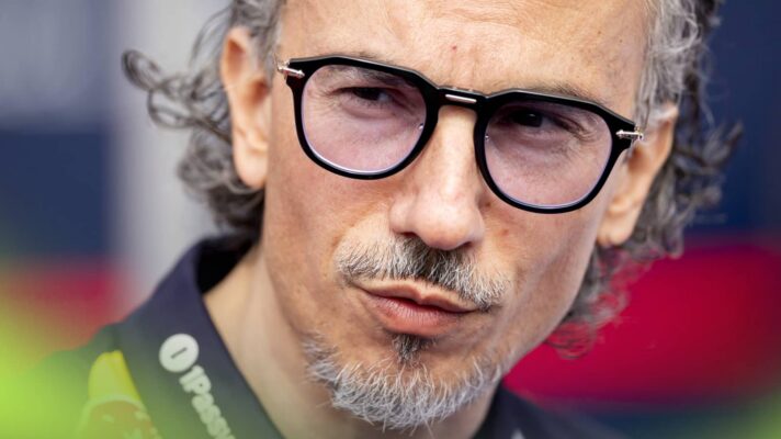 A close-up shot of Laurent Mekies in conversation in the paddock