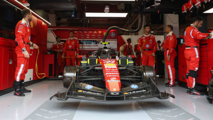 Lewis Hamilton's No44 SF-26 in the Ferrari garage with his mechanics in Miami