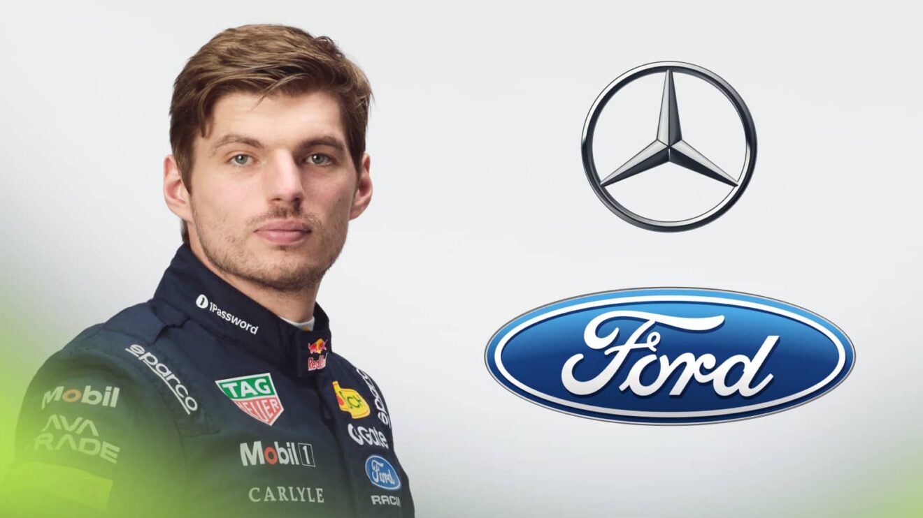 A studio shot of Max Verstappen posing in Red Bull race overalls with Mercedes and Ford logos stacked on the right-hand side