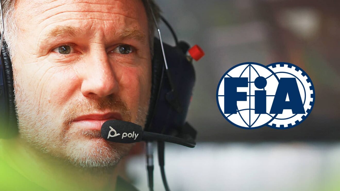 A close-up shot of Christian Horner wearing a set of headphones on the pit wall with an FIA logo alongside him
