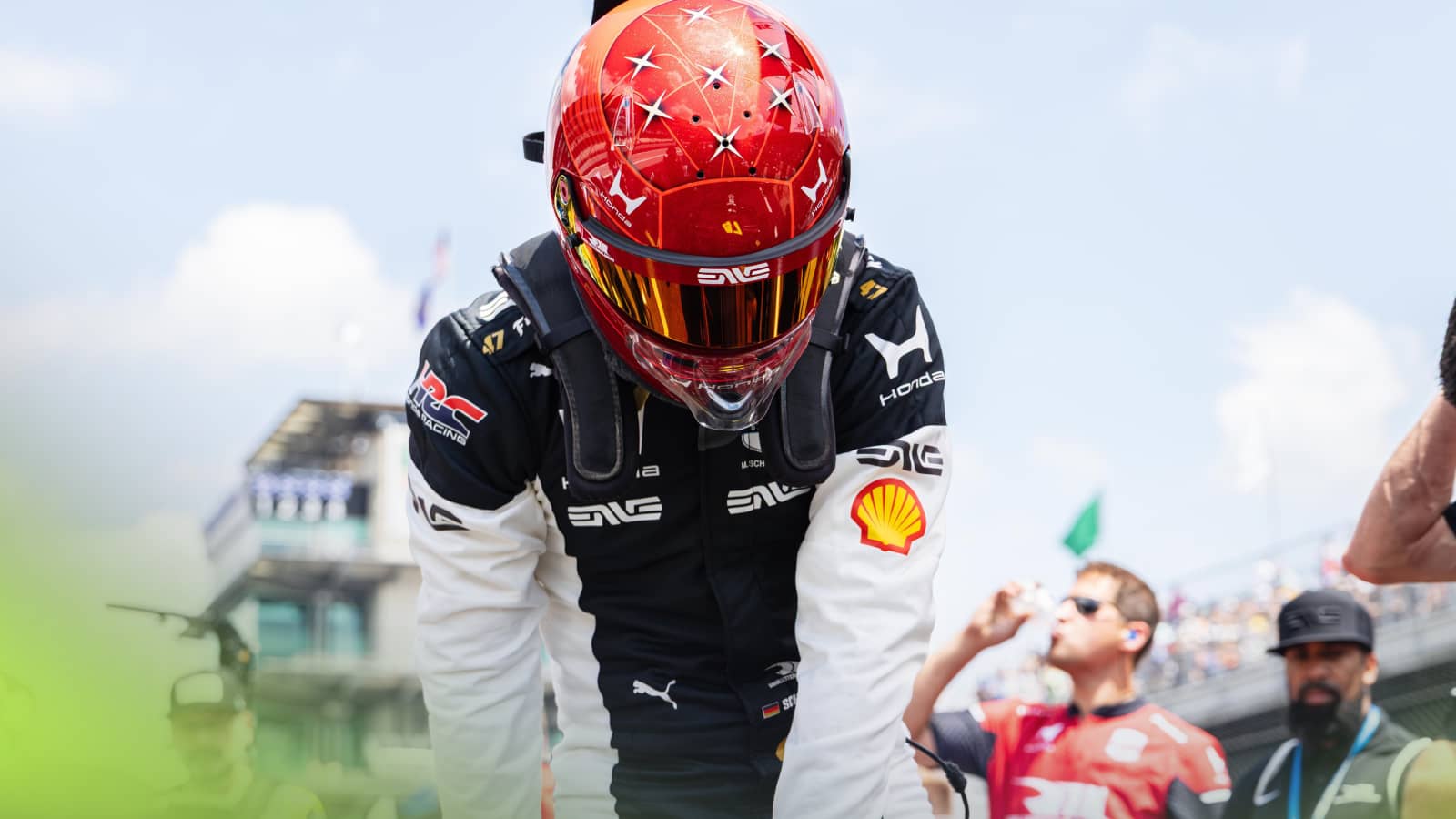Mick Schumacher wearing a red helmet in tribute to father Michael