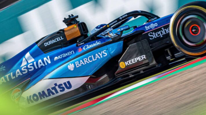 A side-profile shot of Alex Albon's Williams on track at Suzuka