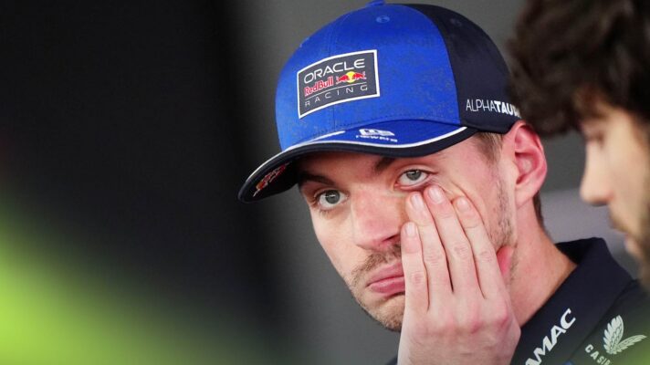 Max Verstappen holds his face in the media pen in Canada.