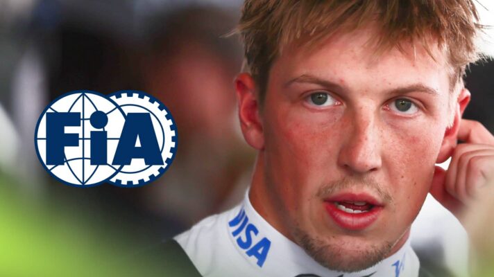 Liam Lawson speaking to the media with an prominent FIA logo alongside him