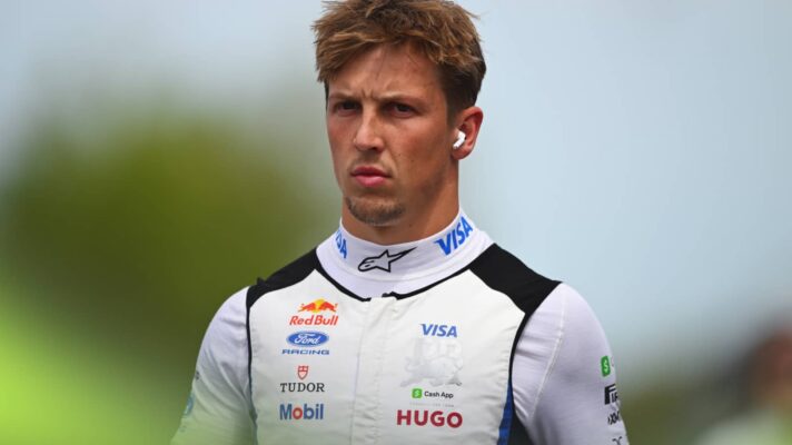 Liam Lawson wearing a cool vest with his overalls rolled down