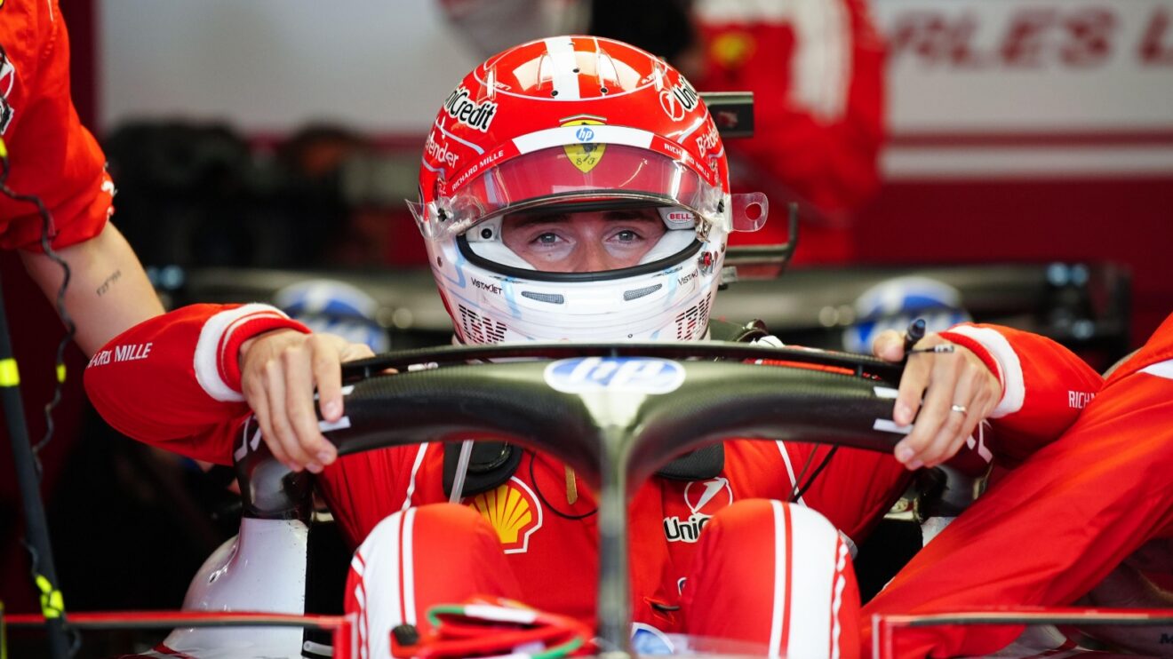 Charles Leclerc climbing into his Ferrari