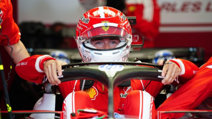 Charles Leclerc climbing into his Ferrari