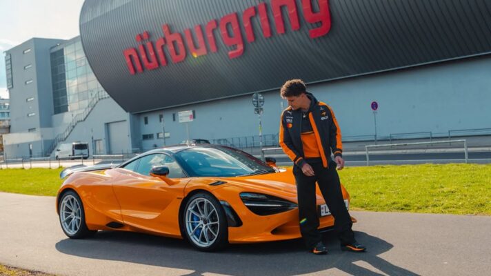 Lando Norris poses with a McLaren 750S at the Nürburgring.
