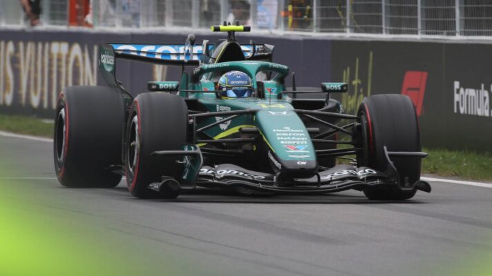 Fernando Alonso drives into the pits in Canada, with Honda Monaco GP preparations underway.