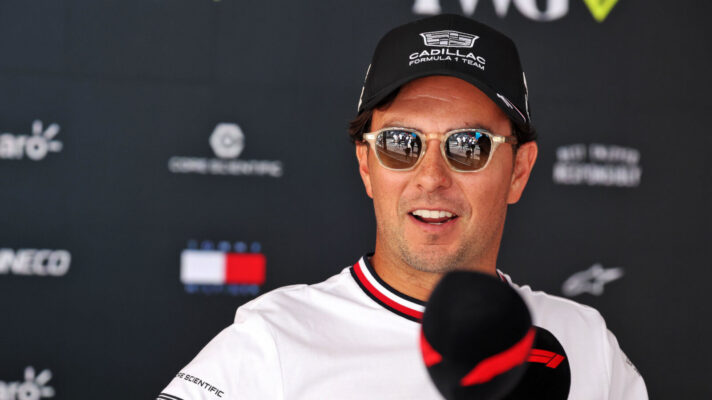 Sergio Perez wearing sunglasses while being interviewed by F1