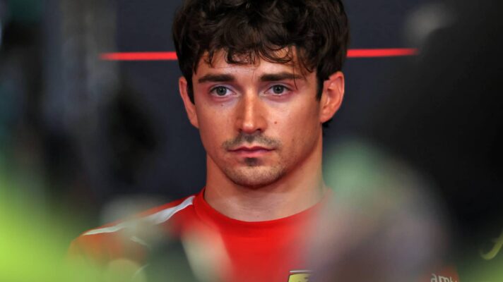 Charles Leclerc looks on in a press conference