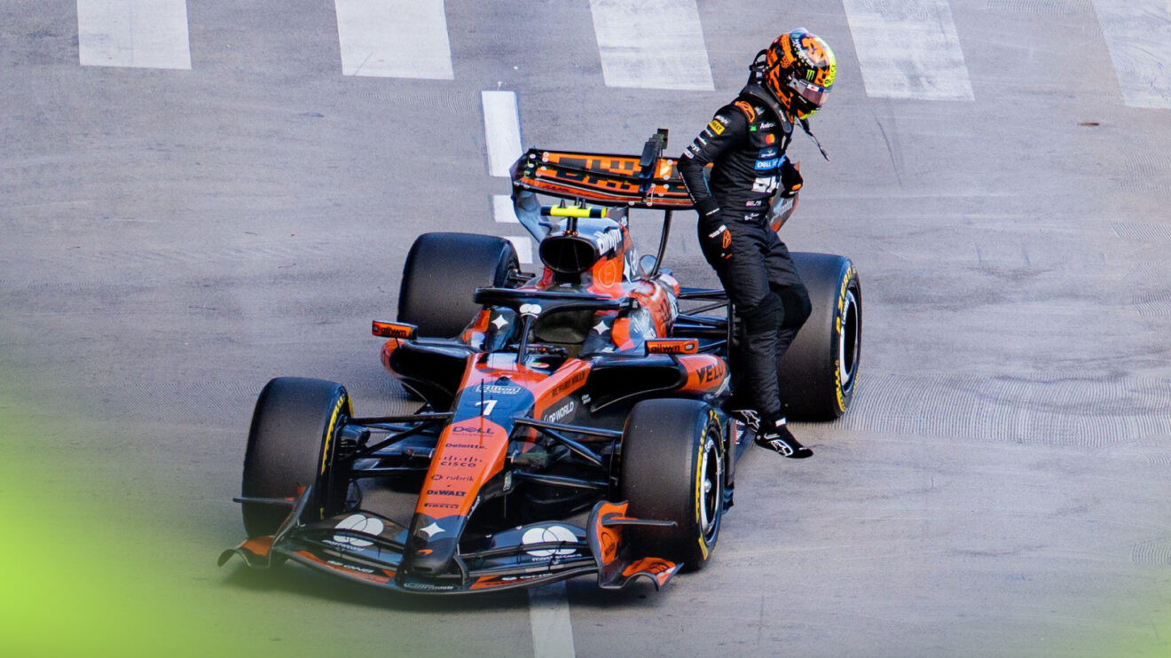 Lando Norris jumps from his McLaren following a stoppage on track during FP2 in Monaco.