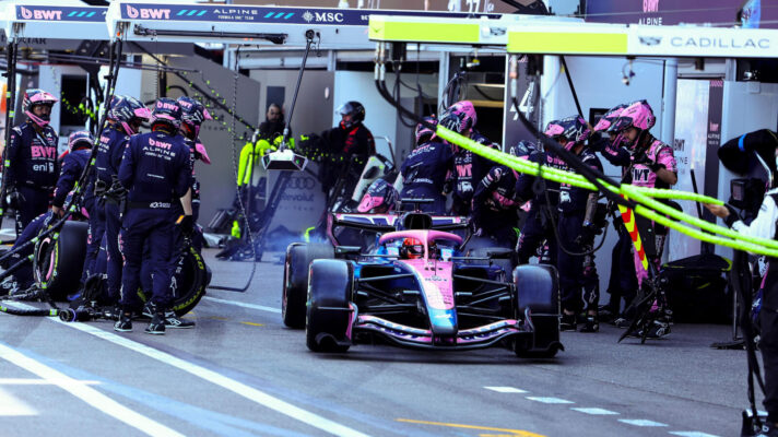 Pierre Gasly pulls away from the Alpine pit box and his mechanics after a pit stop