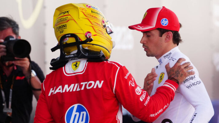 Lewis Hamilton hand on Charles Leclerc shoulder, photographer in the background