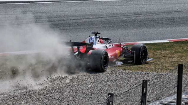 Charles Leclerc kicks up gravel off track after losing power steering, plume of gravel and dust behind his Ferrari