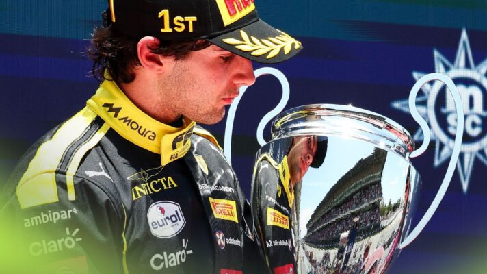 Ferrari junior and Invicta Racing driver Rafael Camara looks at his trophy after winning the Barcelona Formula 2 feature race