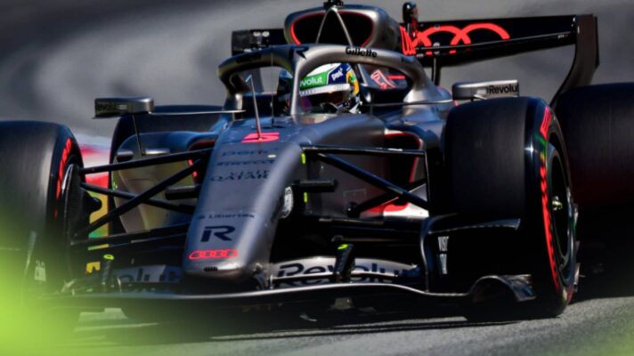 An action shot of Gabriel Bortoleto on track behind the wheel of the Audi R26