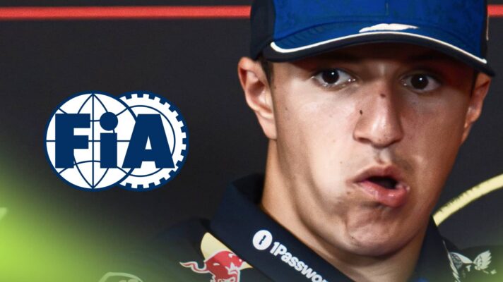 A close-up shot of Isack Hadjar with his mouth open and an FIA logo alongside him