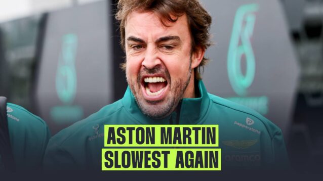 Fernando Alonso with his mouth open wide in the paddock with a banner reading: 'Aston Martin slowest again'