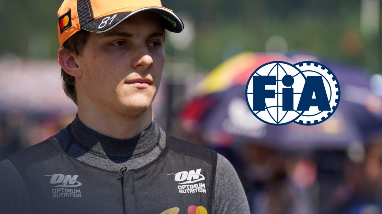 Oscar Piastri looking to the side, FIA logo