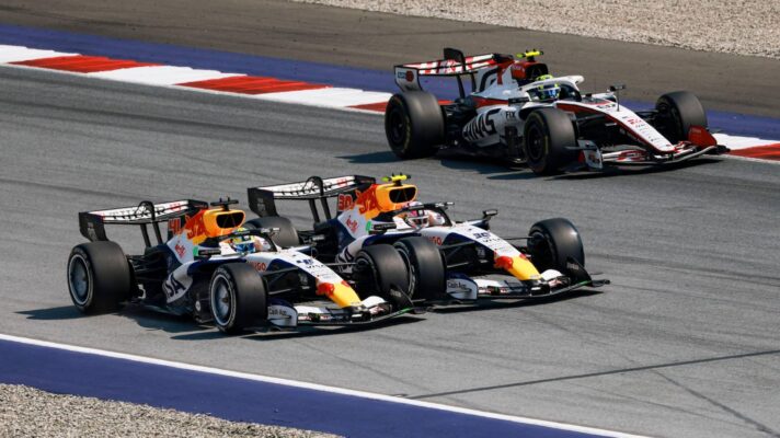 Racing Bulls' Liam Lawson and Arvid Lindblad go to battle, passing the Haas of Oliver Bearman, during the 2026 Austrian Grand Prix