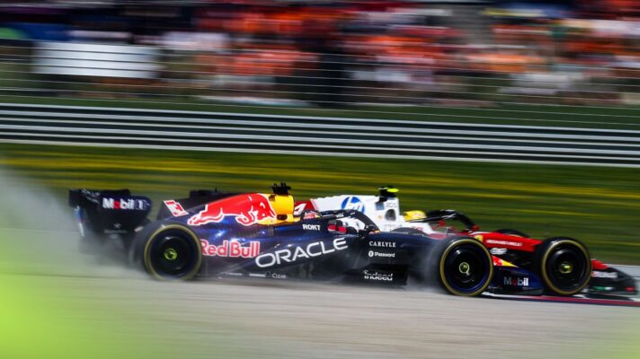 Max Verstappen, Red Bull, kicks up gravel alongside Lewis Hamilton, Ferrari, during the 2026 Austrian Grand Prix