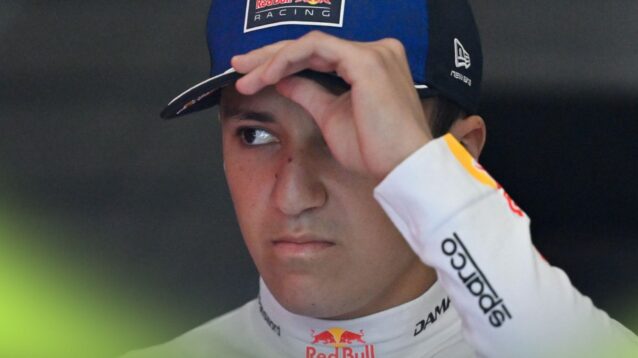 Isack Hadjar holds his cap in the Austrian GP media pen.