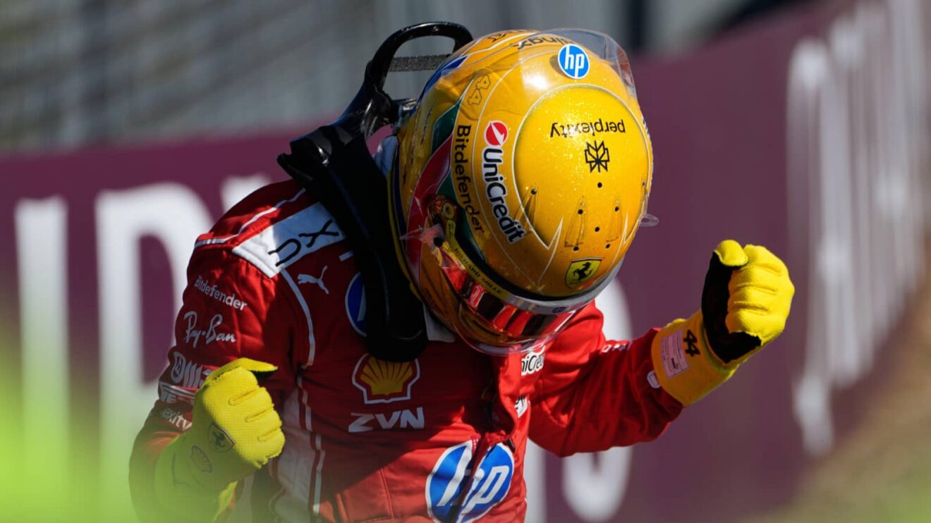 Lewis Hamilton looks down and punches the air with both arms while celebrating his sprint pole