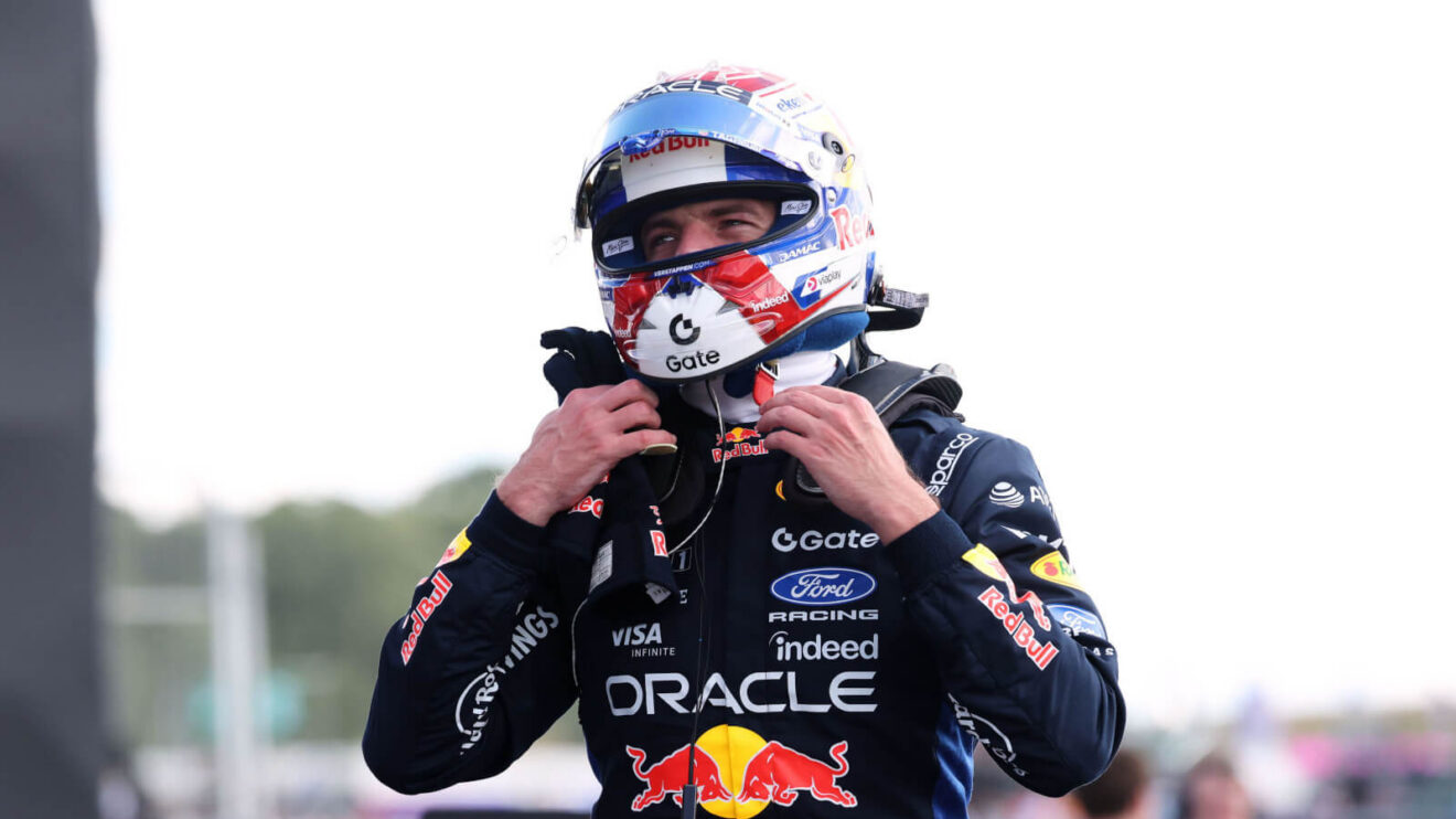 Max Verstappen taking off his HANS device in the parc ferme