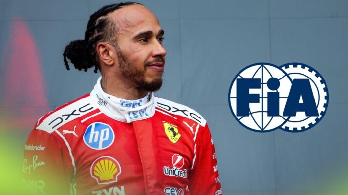 Lewis Hamilton on the 2026 British Grand Prix podium, as an FIA logo appears on the right