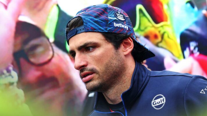 Carlos Sainz walks through the paddock at the British Grand Prix.