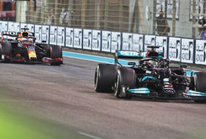 Lewis Hamilton's Mercedes leads Max Verstappen's Red Bull on the straight in Abu Dhabi
