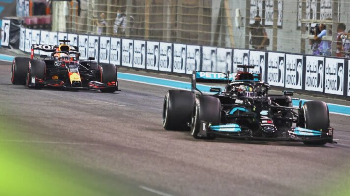 Lewis Hamilton's Mercedes leads Max Verstappen's Red Bull on the straight in Abu Dhabi