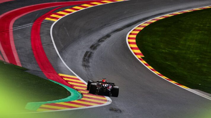 A rear-facing shot of Max Verstappen's Red Bull entering Eau Rouge at Spa