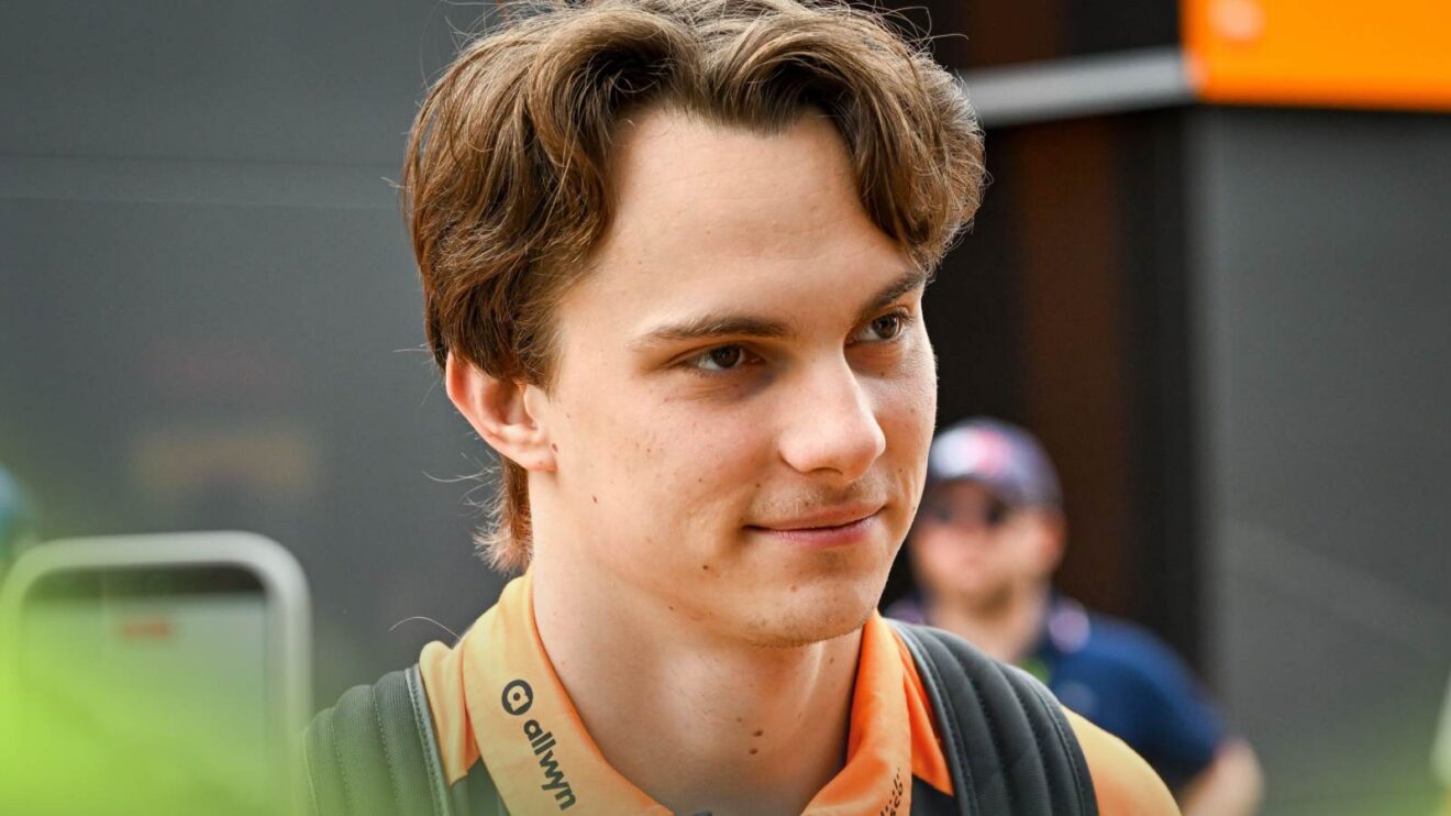 McLaren driver Oscar Piastri walks through the paddock at Silverstone.
