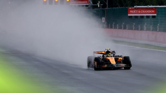 Lando Norris kicks up spray in wet Belgian Grand Prix weather.