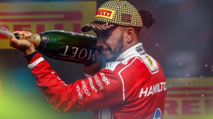 Lewis Hamilton, Ferrari, sprays the champagne on the 2026 British Grand Prix podium