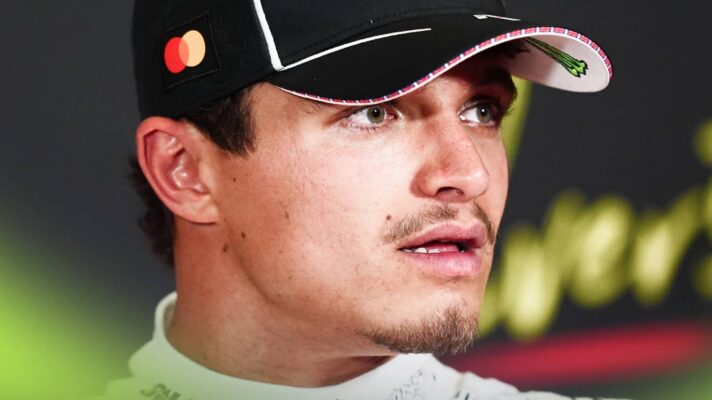 A close-up shot of Lando Norris in a press conference